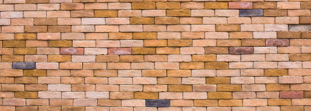 istock Orange grunge brick wall texture background. 1182937442