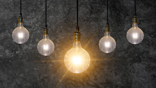 istock different Light bulb idea Many bulbs are arranged in a row and one of them is illuminated. Concept idea 1182938251