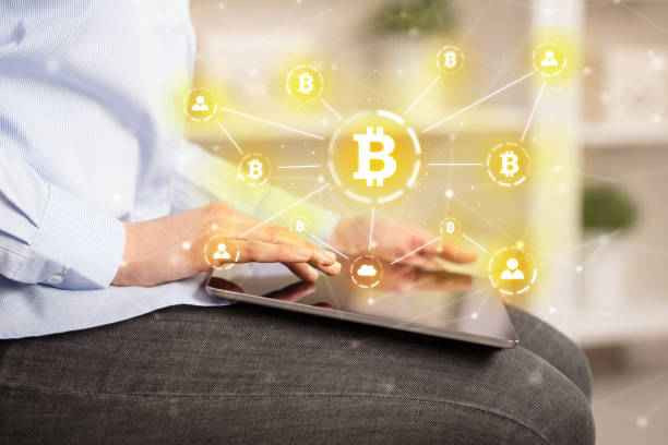 istock Business woman using tablet with bitcoin link network and online concept 1182941313