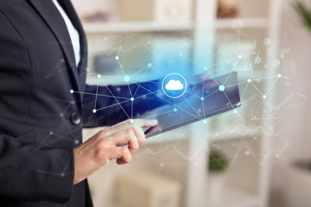 istock Business woman using tablet with cloud connection concept 1182941362