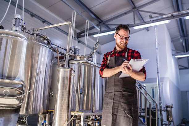 istock Young man working in a craft brewery 1182941689