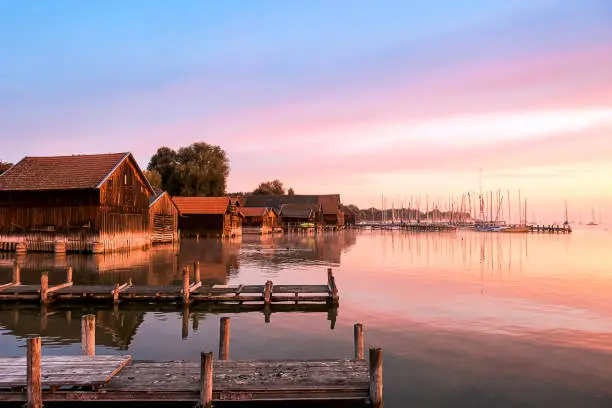 Boat sheds and jetty in the most beautiful light at sunrise