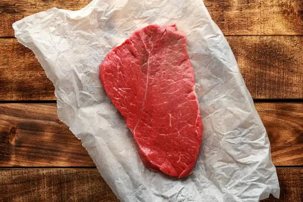 Raw fresh braising beef steak butcher's cut ready to cook.
