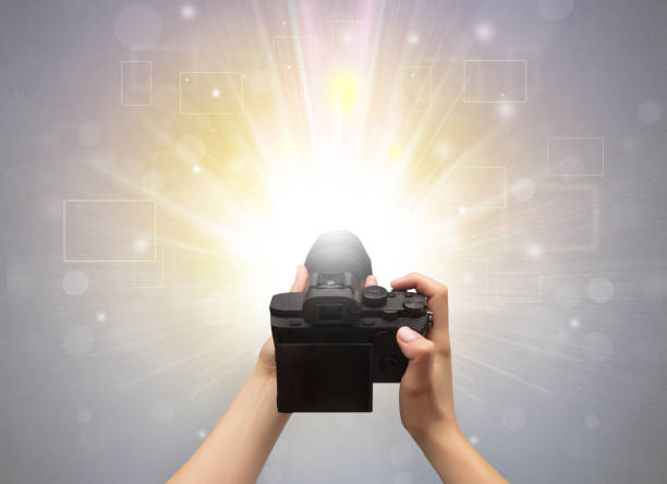 istock Hand taking photo with glowing flash concept 1182942186