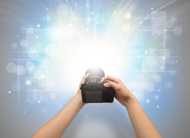 istock Hand taking photo with glowing flash concept 1182942206