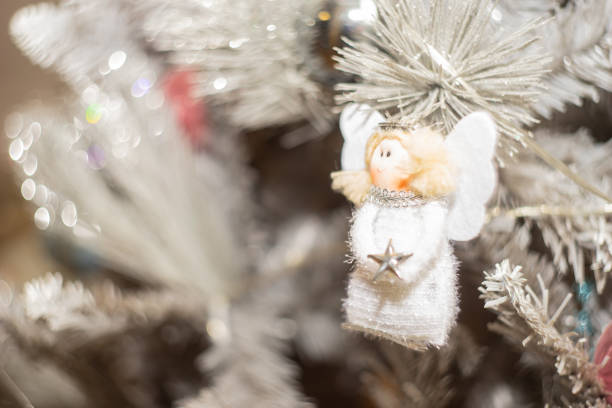 Closeup macro photo of christmas angel ball on christmas tree