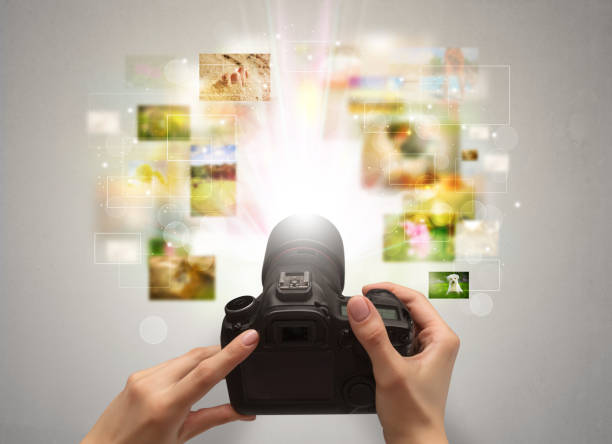 istock Hand captures life events with digital camera 1182942303