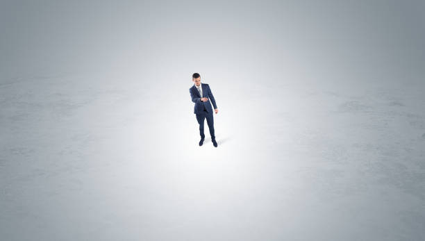 istock Businessman standing in the middle of an empty space 1182943181