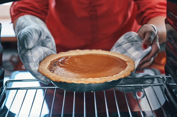 istock Baking Pumpkin Pie for the Holidays in the Oven 1182944517