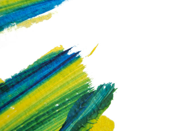 istock Blue, green and yellow acrylic painting texture on white paper background by using rorschach inkblot method. 1182948082