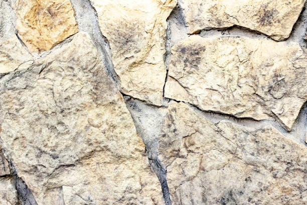 istock Stones texture and background. Texture of a stone wall. Old castle stone wall texture background 1182948811