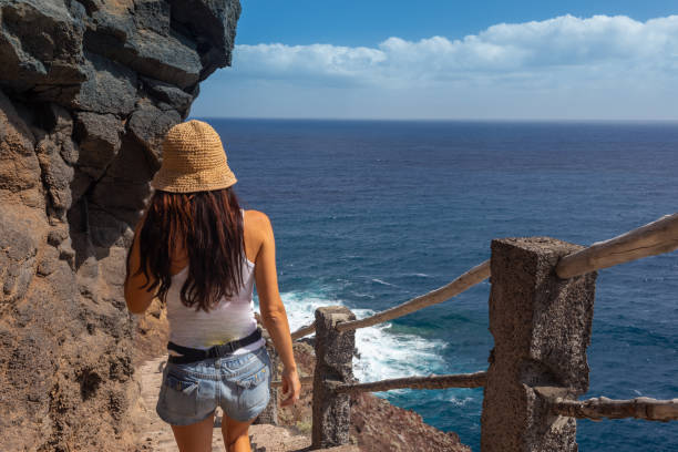 istock young active woman walks on the path 1182949867