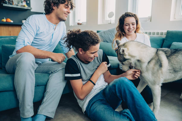 istock Cheerful family with Husky 1182951425