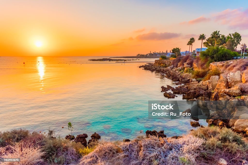 Fig tree bay beach in Protaras, Cyprus Beautiful beaches of Cyprus at sunset Republic Of Cyprus Stock Photo