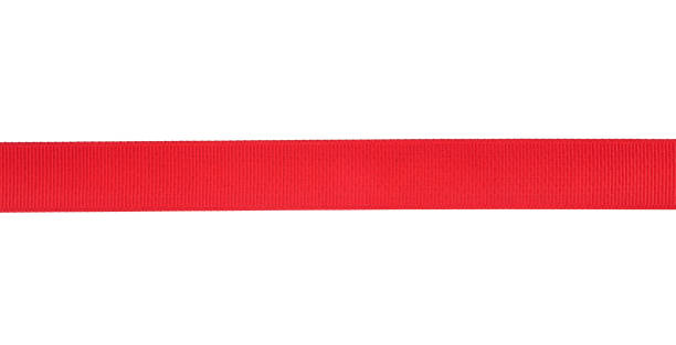 istock Beautiful flat red silk ribbon isolated on white background. Gift ribbon. 1182952599