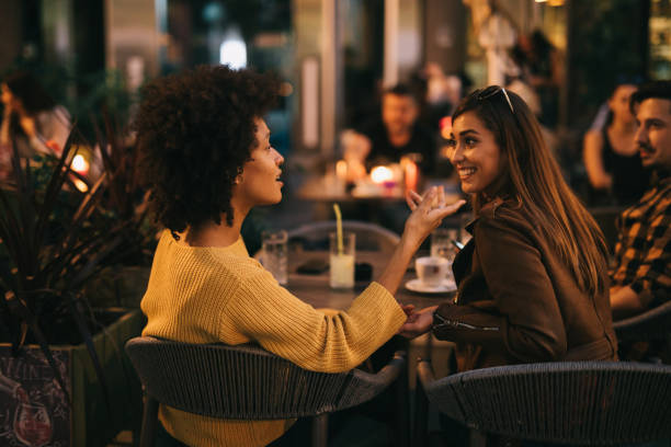 istock Friends sitting and relaxing at cafe 1182953185