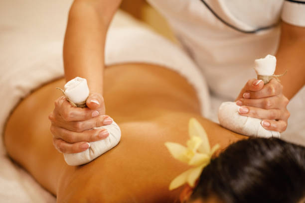 istock Close-up of back massage with herbal compress. 1182953255