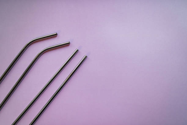 istock Stainless steel straws on pink background. Eco friendly concept. Copy space. 1182953672