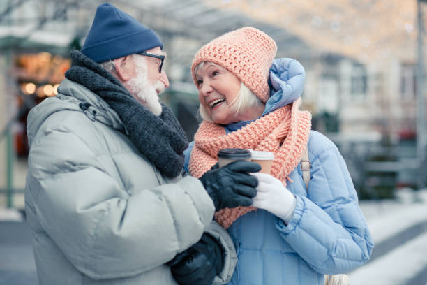 istock Happy elderly lady laughing while looking at her husband 1182953736