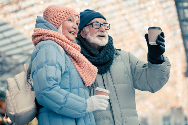 istock Two pensioners enjoying coffee outdoors on Christmas day 1182954957