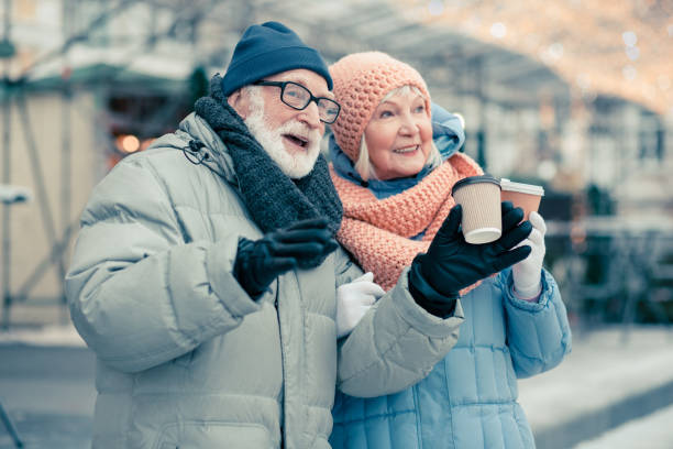 istock Bearded pensioner talking to his wife outdoors and gesturing 1182955013