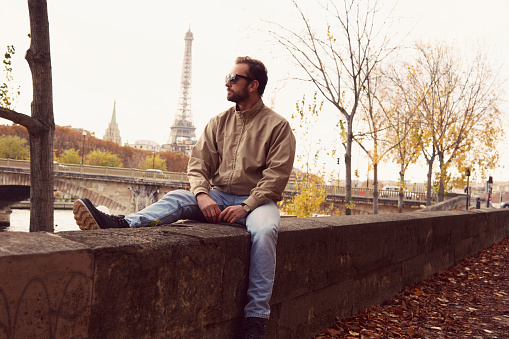 Handsome man enjoying in Paris.