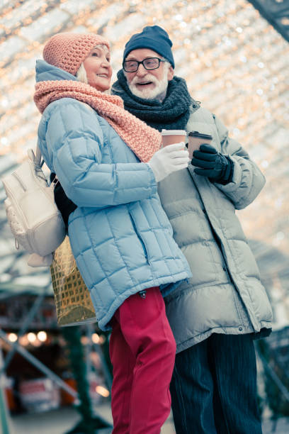 istock Stylish pensioners relaxing outdoors on Christmas day 1182955171