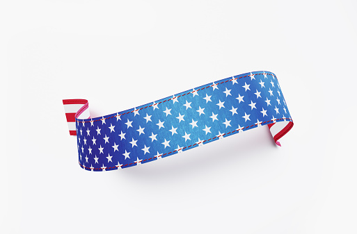 Ribbon banner textured with American flag on white background. Horizontal composition with clipping path.