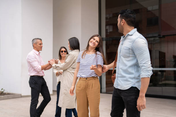 istock Group of entrepreneurs talking outside a co-working building 1182958296