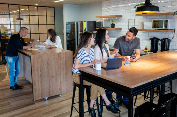 istock Group of entrepreneurs working at a co-working office 1182958318