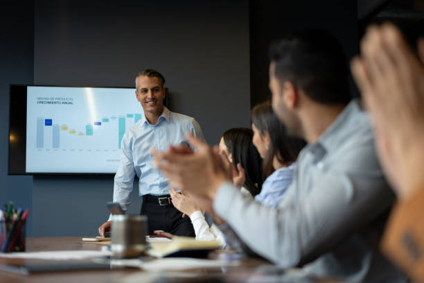 istock Happy business man after a successful presentation 1182958378