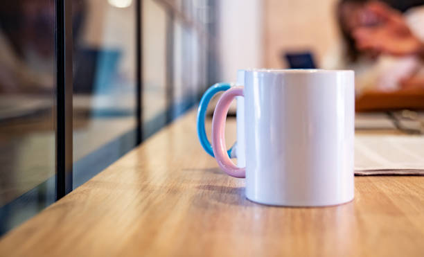 istock Cups of coffee on the table at a co-working 1182958406