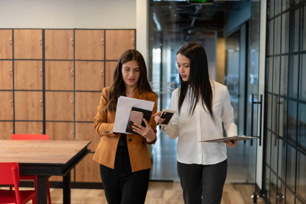 istock Business women working together at a co-working office 1182958422