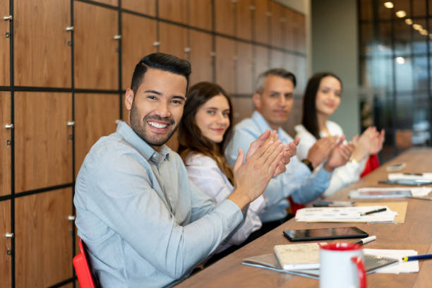 istock Happy business team applauding at the office 1182958455