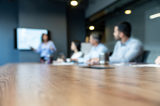 Group of business people in a meeting at the office - blurred concepts