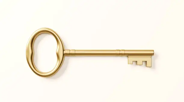 Gold colored bronze key on white background. Horizontal composition with clipping path.