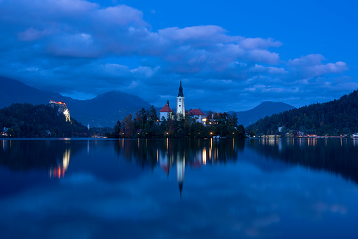 Lake of bled at twlight - bled island  and cloudy and colored  sky