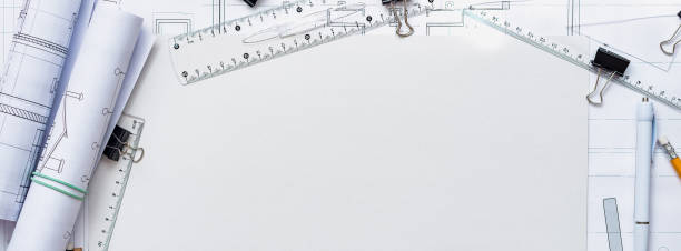 istock Architectural plans, pencil and ruler on the table. Place for your text. 1182960126