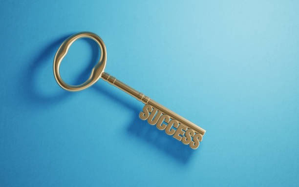 istock Bronze Success Key on Blue Background 1182960232