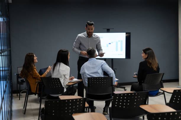istock Business man making a presentation in a meeting 1182960492