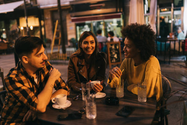 istock Friends sitting and relaxing at cafe 1182960672