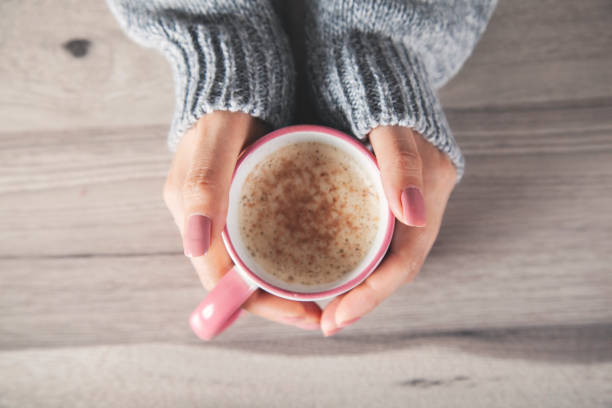istock woman hand cup of coffee 1182963011