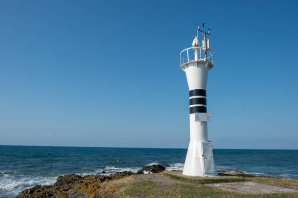 istock Lighthouse near the sea 1182964508