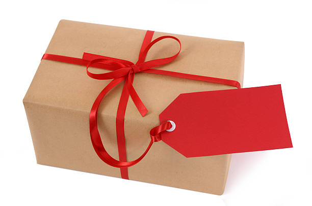 istock Brown paper package with red ribbon and tag 118296633