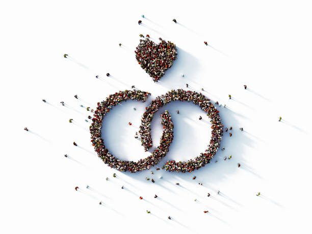 istock Human Crowd Forming Wedding Rings with Heart Symbol 1182967196