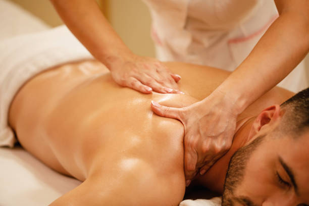 istock Relaxed man enjoying in back massage at health spa. 1182967215