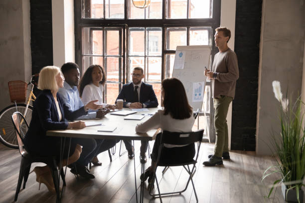istock Multiethnic business team having discussion during corporate presentation 1182967291