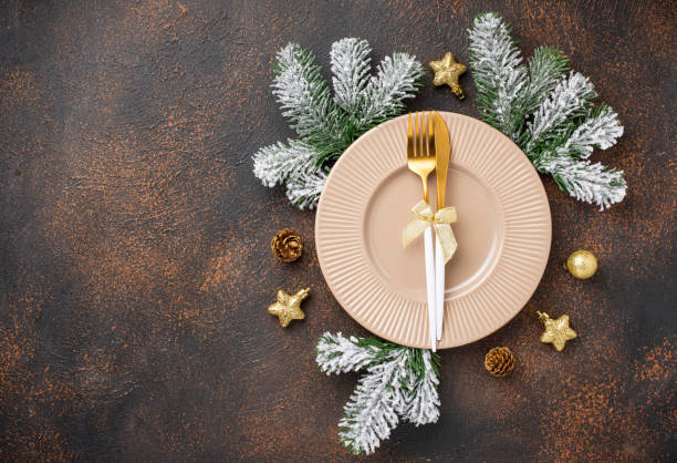 istock Christmas table setting and golden decor 1182967502