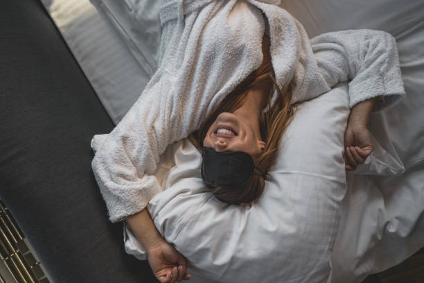 Beautiful young woman waking up