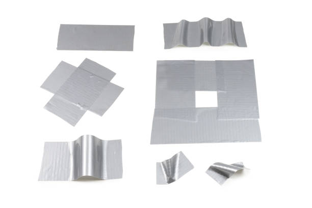 istock Silver scotch tape pieces isolated on white background. 1182970725